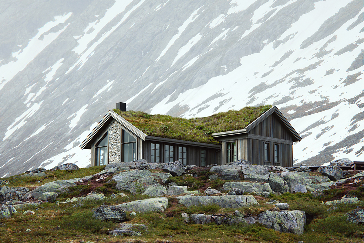 En hytte med gress på taket ligger ved foten av et snødekt fjell